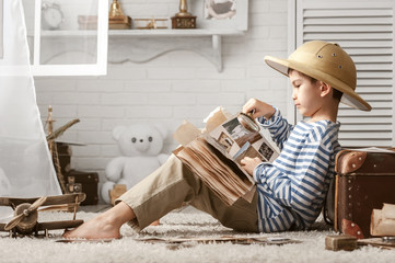 Boy in image traveler play in his room
