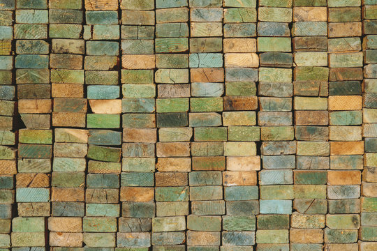 A stack of wood stud boards known as 2 x 4s. Used for construction and scaffolding.