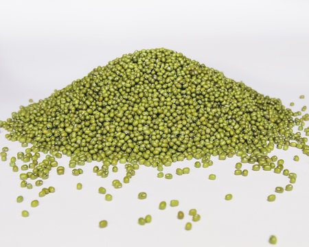 Mung beans, also known as green gram or golden gram, native to India. Heaped on a white background.