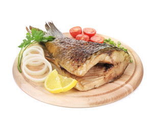 Baked fish on wooden board