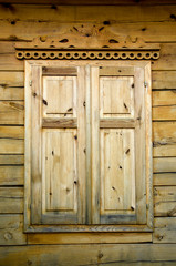 Obraz na płótnie Canvas wooden windows shutters on farm house