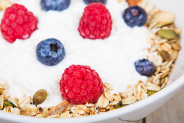 Fresh yoghurt with home made cereals and muesli, fresh raspberry