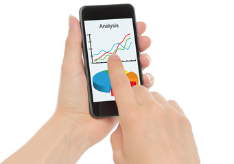 Man hand holds smart phone with graphs