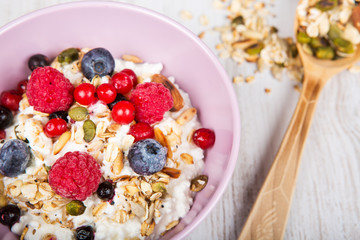 Fresh yoghurt with home made cereals and muesli, fresh raspberry