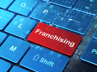 Business concept: Franchising on computer keyboard background