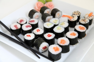 sushi set on white plate. Traditional japanese sushi rolls