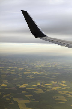 The winglet or wing tip of an aircraft viewed from the passenger window.