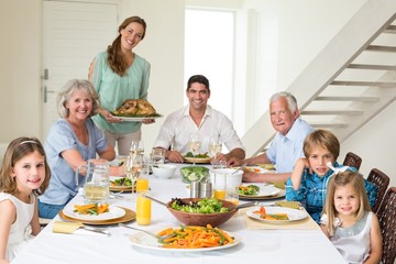 Obraz na płótnie Canvas Family having meal at dining table
