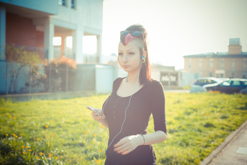 young beautiful punk dark girl listening music