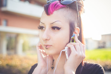 young beautiful punk dark girl listening music