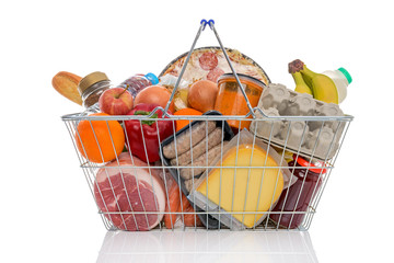 Shopping basket full of groceries isolated on white. - 62858573