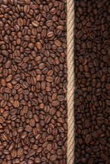Illuminated and dark coffee beans and rope