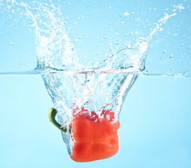 red pepper splashed into water