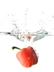 red pepper splashed into water