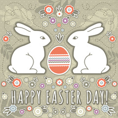 greetings card with easter eggs and two rabbits