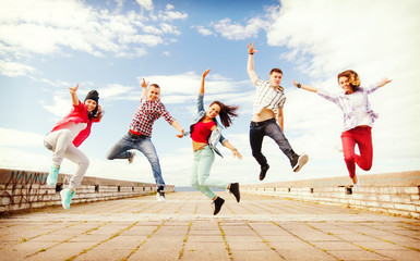 group of teenagers jumping