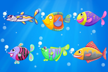 Obraz na płótnie Canvas An ocean with six colorful fishes