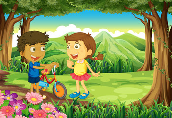 Obraz na płótnie Canvas A forest with kids and a bike