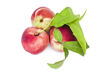 peach with leaves isolated on white background