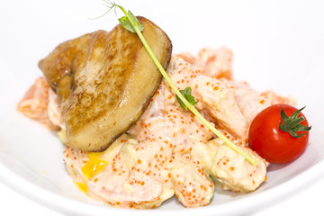 salad, fish and eggs decorated with greens and tomatoes