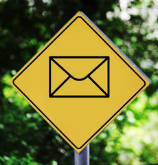 Yellow traffic label with envelope pictogram