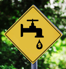 Yellow traffic label with leaking faucet pictogram