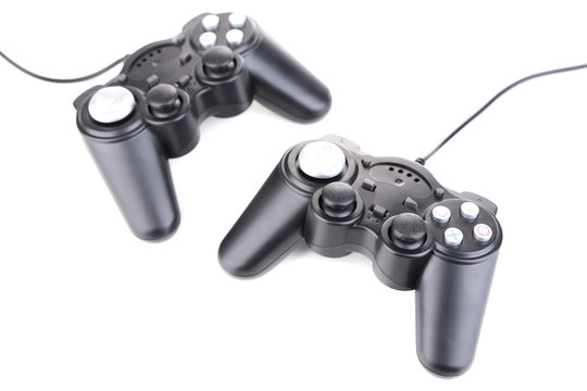 Black game controllers isolated on white