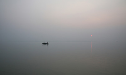 Sunset on holiest river in India. Ganges delta in Sundarbans