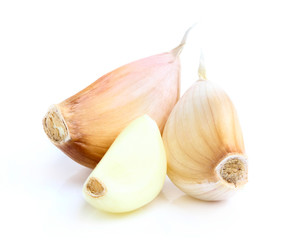 Three cloves of garlic closeup.