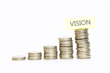 Isolated coins stacked with vision label on top