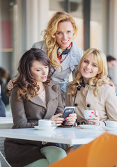 Three fabulous women drinking coffee