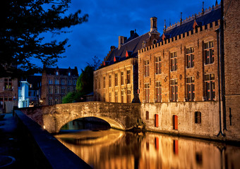 Historic medieval buildings along a canal in Bruges, Belgium