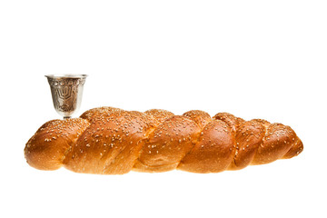 Challah and Silver Kiddush cup for Jewish Sabbath