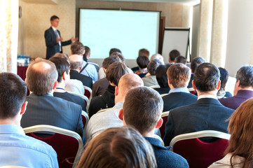 people sitting rear at the business conference