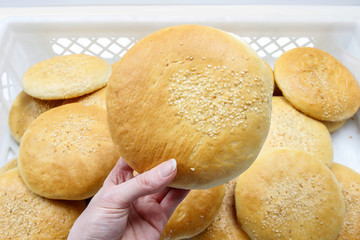 Woman holding bun in hand