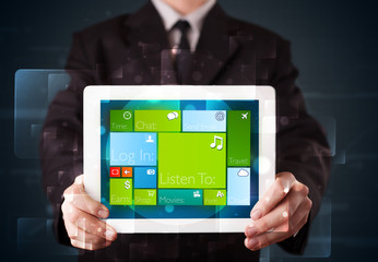 Businessman holding a tablet with modern software operational sy