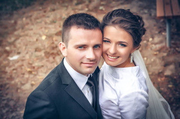 Wedding shot of bride and groom in park