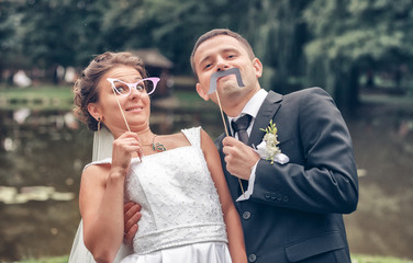 Fototapeta premium Wedding shot of bride and groom in park