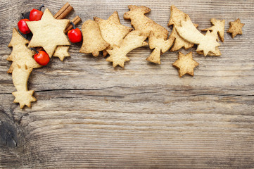 Christmas cookies on wooden background. Copy space, blank board
