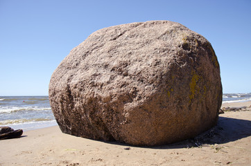 big stone on summer sea beach