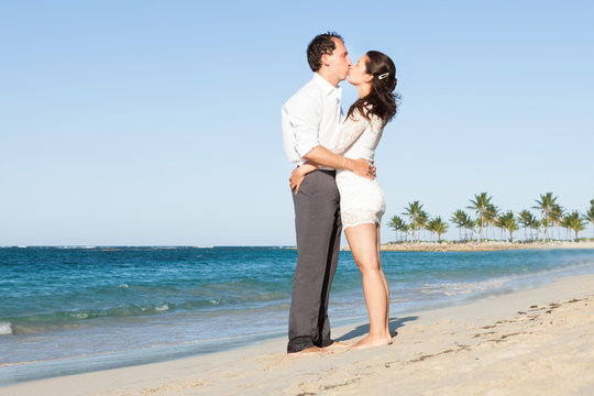 Affectionate Couple Kissing At Beach