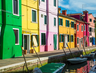 Fototapeta na wymiar Green Yellow Pink and Red Homes