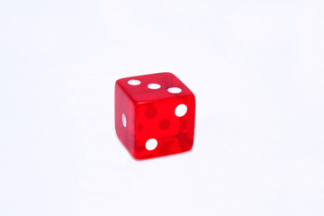 Red dice in white background