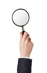 Magnifier glass in woman hand isolated on white