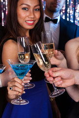 Friends Toasting Drinks At Nightclub