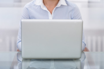 Businessperson Working On Laptop At Workplace