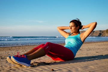 Fototapeta na wymiar Fitness woman sit ups exercising