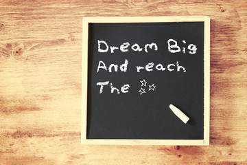 the phrase dream big written on chalkboard