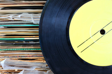 close up of old record and records stack.  