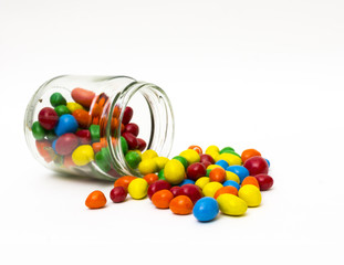 Isolated colorful candy out of jar on white background - selecti - 62900102